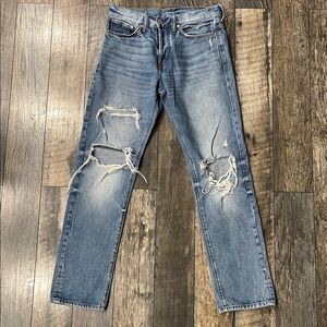 Classic Blue Distressed woman’s button up Jeans